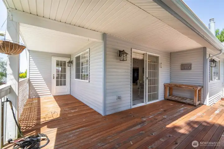 Deck to Sliding Glass Door and Kitchen Side Door.