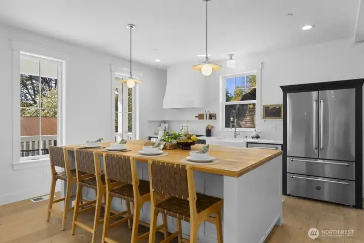 Designer lighting, upgraded appliances, and refined hardware throughout.