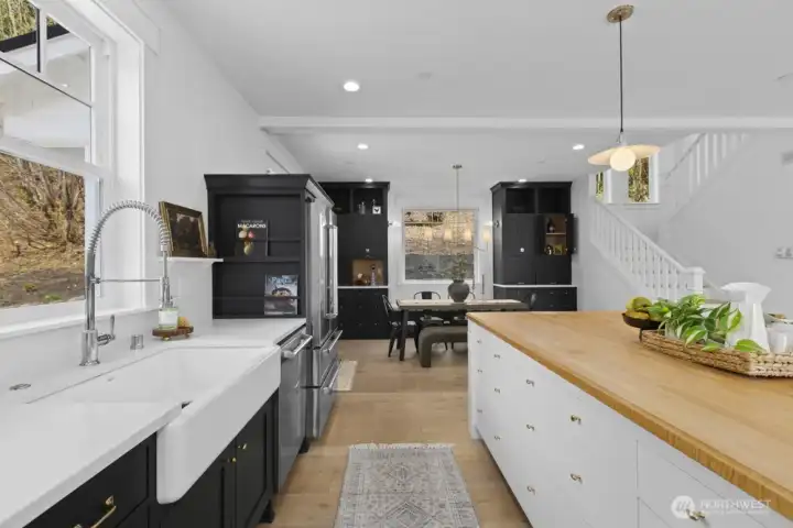 Custom maple cabinetry and island, milled from trees on the property, adding true character and story.