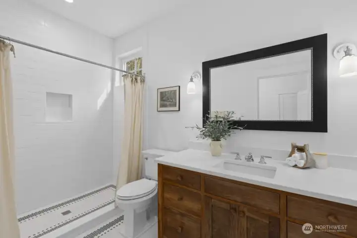 Timeless penny tile brings character and charm to the walk-in shower.