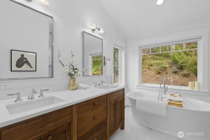 Stunning primary 5-piece ensuite with soaking tub and spa-like feel.