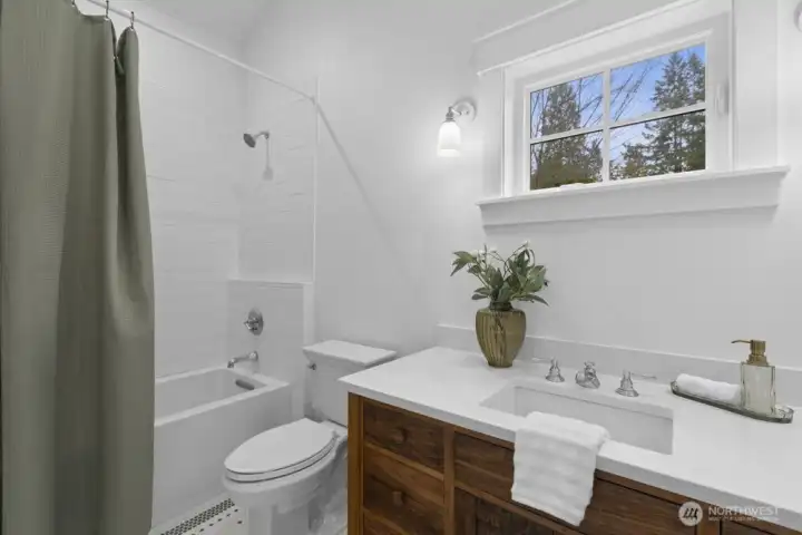 Well-placed full bath serving the bedrooms.