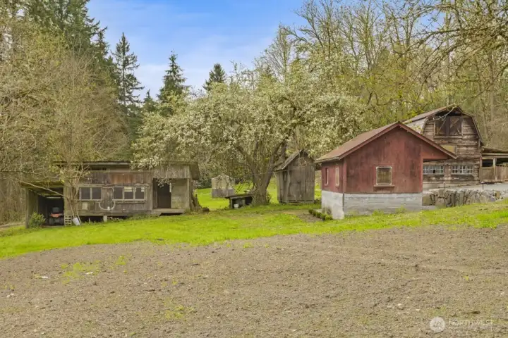 Original outbuildings rich in character, including a milk house, chicken coop, and more.