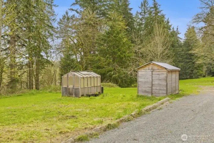 Greenhouse and well house.