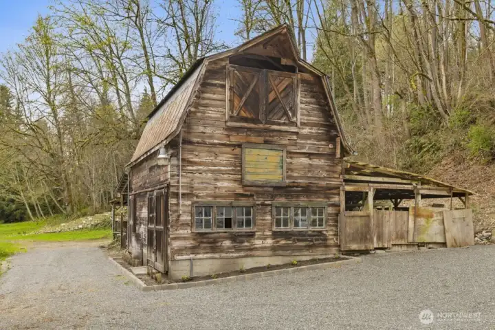Original barn offers added covered storage and flexibility.