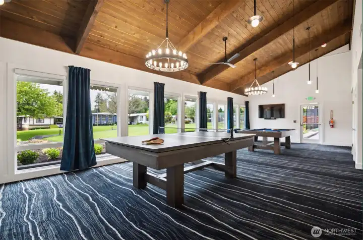 Clubhouse game room with foosball and pool table
