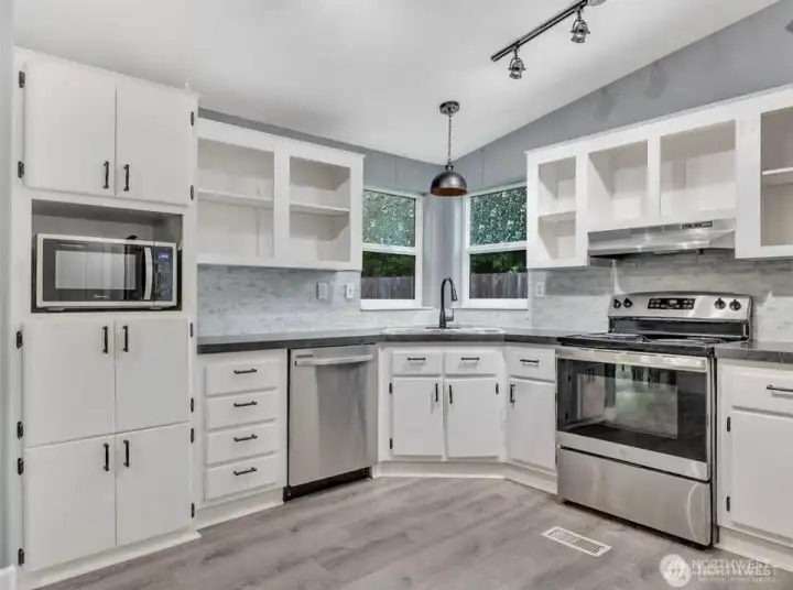 All-important east-facing window over the kitchen sink makes dishwashing a pleasure - but there is a handy dishwasher right there too.