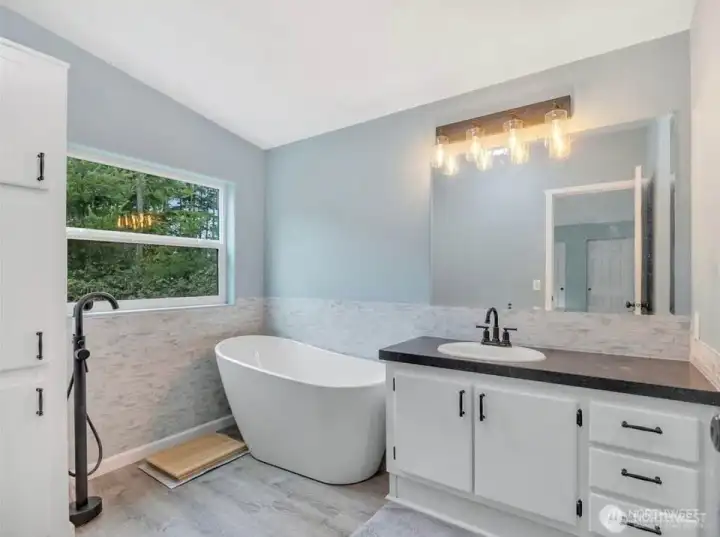 Bathroom has an upscale soaking tub (to be installed).
