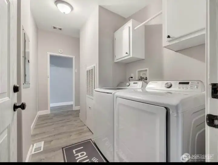 Laundry room with easy access to the garage. Like new washer and dryer are included.