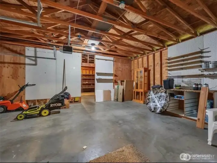 Attached garage is just shy of 1,000 sqft and has a 2-car garage and additional shop space.