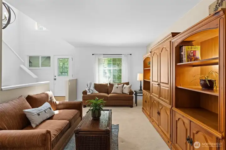 Light-filled living room with easy flow to adjacent entry and dining spaces. Light-filled living room with easy flow to adjacent entry and dining spaces.
