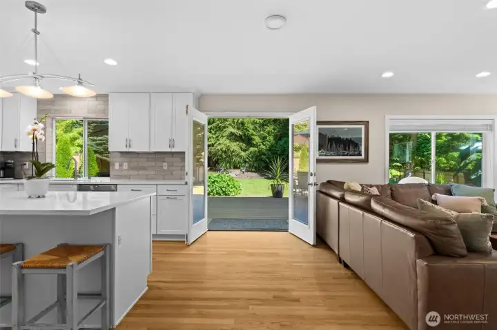 French doors create an inviting connection between the indoor living spaces and landscaped yard. French doors create an inviting connection between the indoor living spaces and landscaped yard.