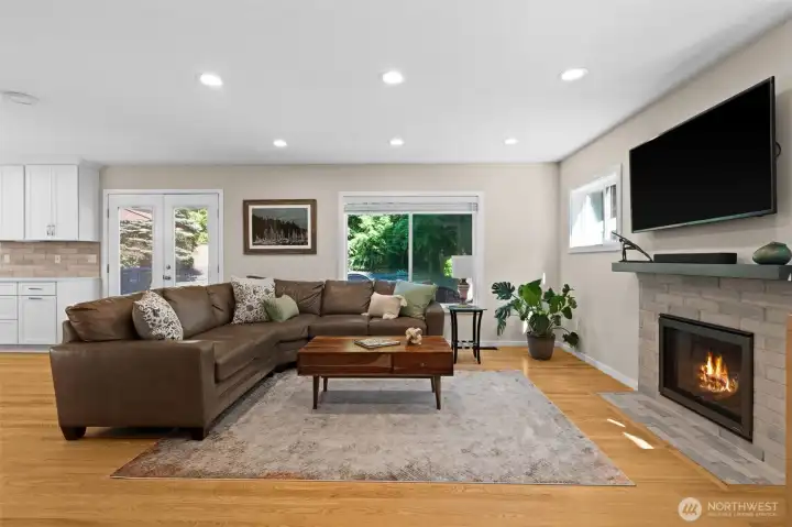 Warm and welcoming family room centered around a modern gas fireplace. Warm and welcoming family room centered around a modern gas fireplace.