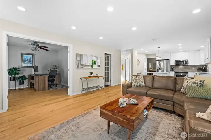 Open living area with recessed lighting, generous seating space, and adjacent flex room access. Open living area with recessed lighting, generous seating space, and adjacent flex room access.