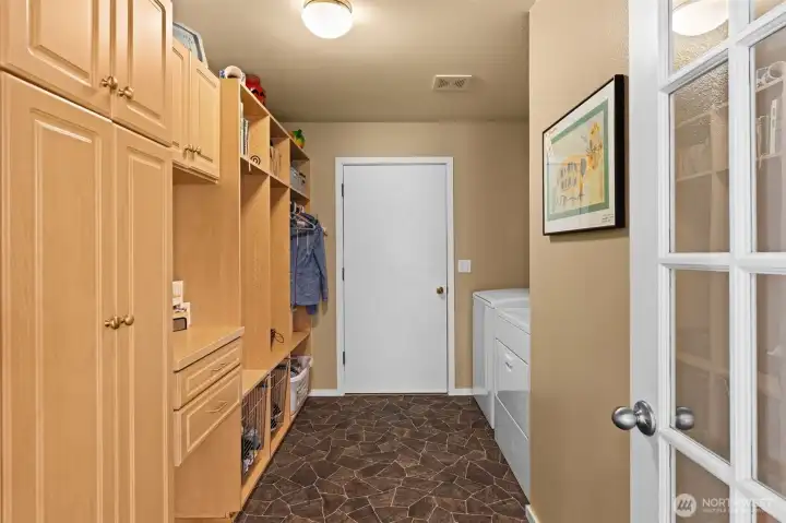 Functional laundry and mudroom space with built-in storage and convenient access to the garage. Functional laundry and mudroom space with built-in storage and convenient access to the garage.