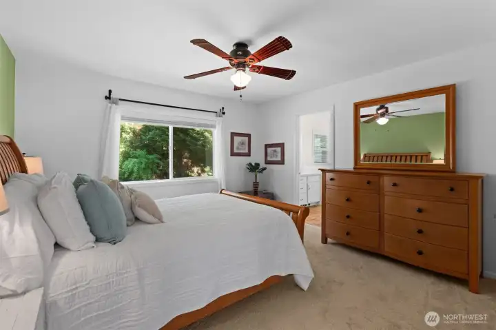 Expansive primary retreat with backyard views and direct connection to the en suite bathroom. Expansive primary retreat with backyard views and direct connection to the en suite bathroom.