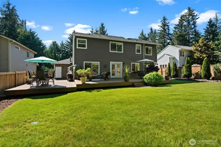 Well-maintained outdoor setting with expansive deck space, established greenery, and room to entertain. Well-maintained outdoor setting with expansive deck space, established greenery, and room to entertain.