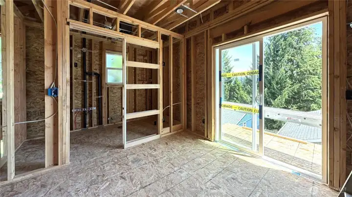 Primary bedroom w/ ensuite bath and deck on 3rd floor