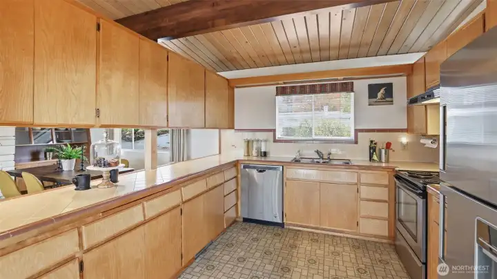 Custom, mid-century cabinets in the kitchen that are a magnetized