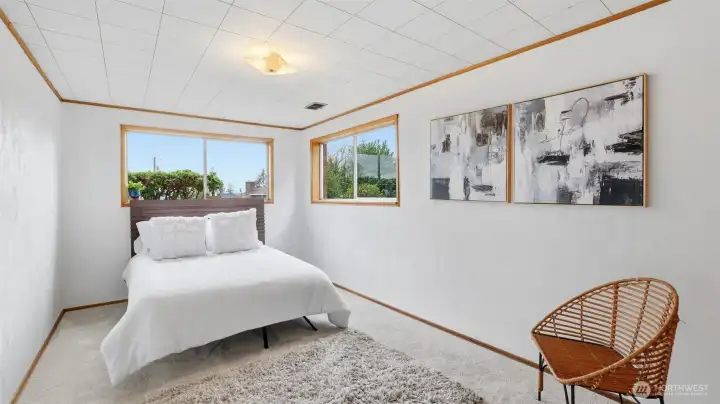Guest bedroom on the lower level with fresh paint and carpet