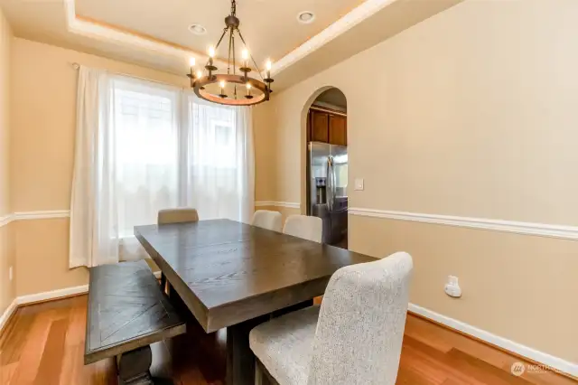 Gorgeous dining area with accent light in ceiling.