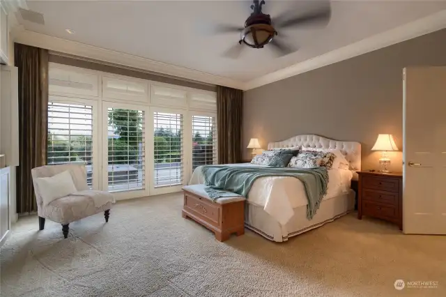 Primary bedroom features: floor to ceiling custom cabinetry, gas fireplace, a hotel style curtain track system, and high-end custom touches all throughout.