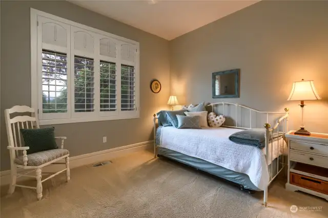 Bedroom #3 is located on the south end of the home and overlooks the backyard. There is also custom cabinetry inside of the closet. Bedroom #3 adjoins a full bath with bedroom #2.