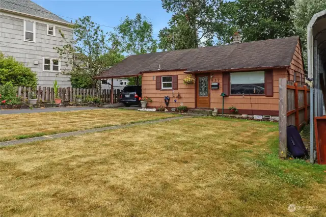 This home features an attached carport for convenient covered parking and storage, along with additional off-street parking in the paved driveway, provids ample space for multiple vehicles. The listing price includes a new roof too!