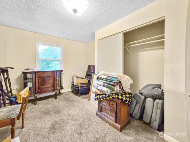 A second view of bedroom 1 highlights the ample closet space, offering convenient storage and helping keep the room organized and clutter-free