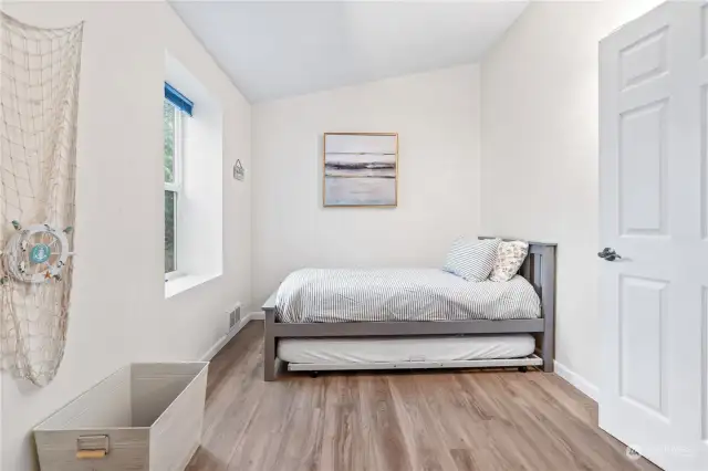 Bedroom #2 w/Laminate Floors and Window overlooking the Front Yard.