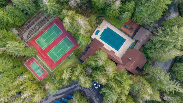 Tennis, Basketball and Pickle Ball Courts on the Left and the Pool and Spa on the Right,  behind the Clubhouse.