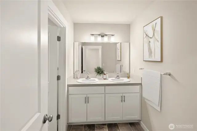 Upper floor bathroom offers double sink vanity convenience.                                                      virtually staged