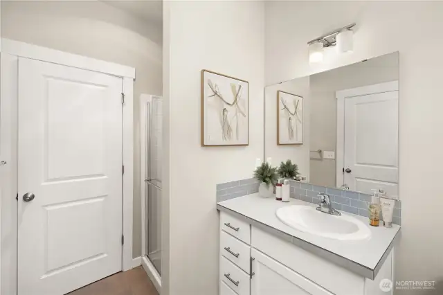 Main floor three quarter bath.                                                                                               virtually staged