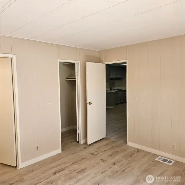 Master Bedroom looking towards Walk-in closet and Kitchen in distant background