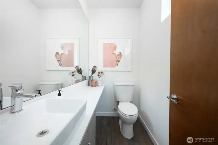 The thoughtfully designed guest bath enhances comfort and convenience, making it easy to host friends and family with style.