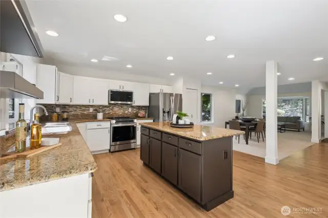 Enjoy cooking with a full suite of premium new LG stainless steel appliances and polished slab counters.
