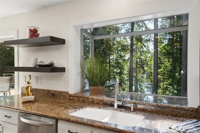 Light-filled garden window with tranquil views of greenery and Lake Wilderness.