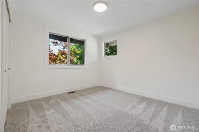 One of three extra bedrooms providing ample space on the upper level.