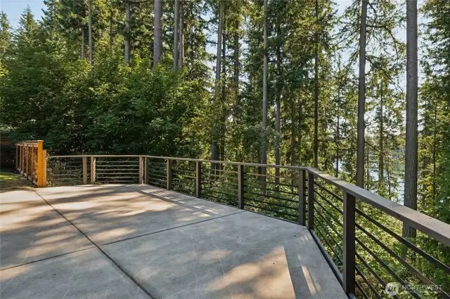 Scenic lower patio with railing provides even more opportunity for festive gatherings or peaceful moments. Steps away from the lower basement bonus room.