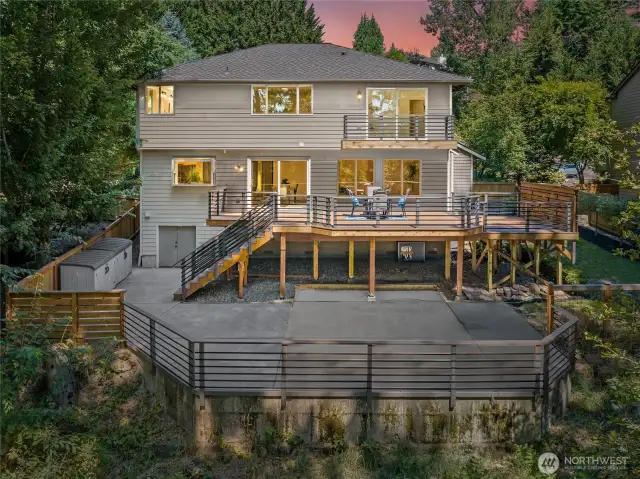 A look at the rear of the home showcases the extraordinary outdoor living areas.