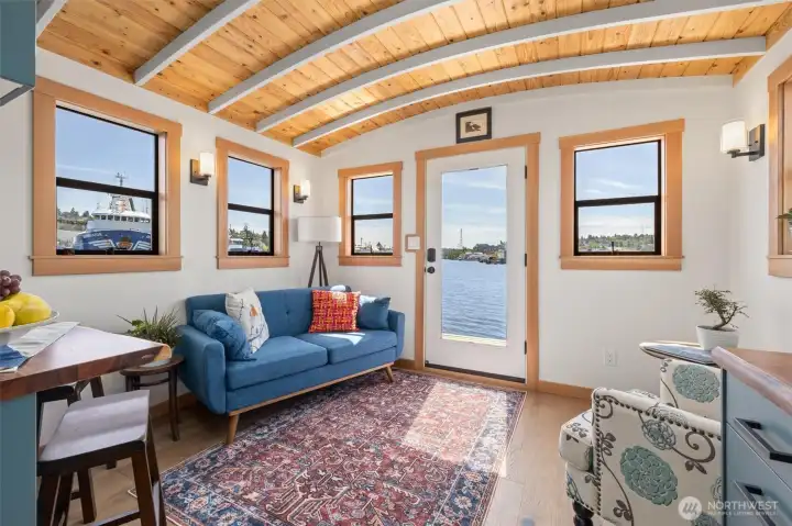 Coved wood ceilings with skylight and tons of windows