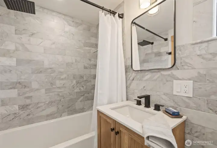 Full tub and rain shower