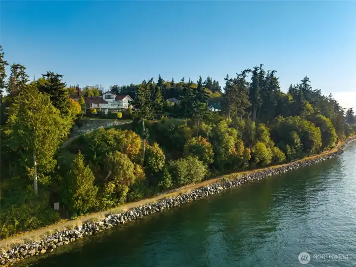 An aerial view showcases the privacy of this property, yet you are close to shopping, restaurants, and Anacortes Parks.