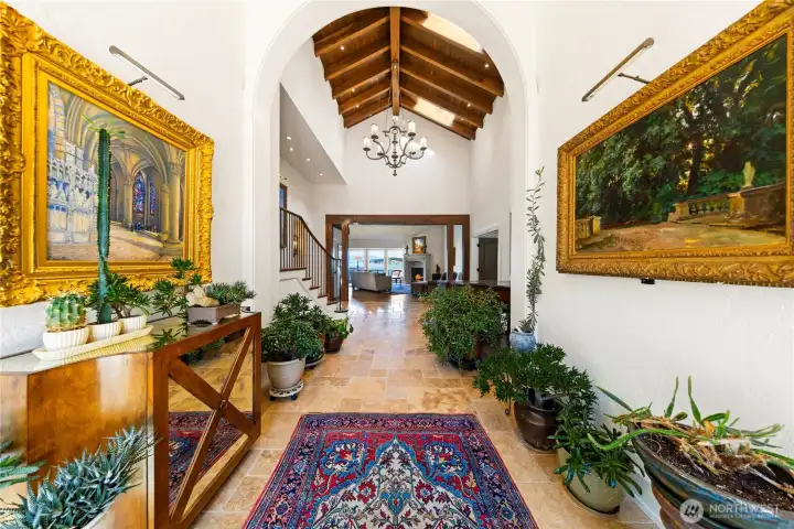 Step inside to vast foyer with soaring ceilings and architectural creating anticipation of the timeless elegance that awaits. The floor is rare large tiles of tumbled limestone.
