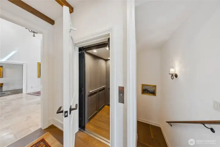 A private elevator provides effortless access to all three levels, blending convenience with thoughtful design.