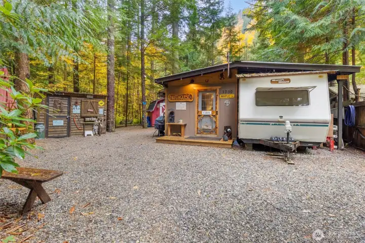 Trailer with huge side addition. Tool shed is to the left.