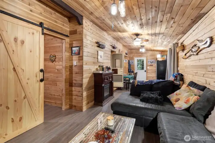 Barn door leading into second bedroom.