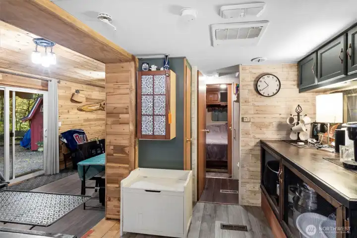 Bathroom off of kitchen leading into trailer bedroom.