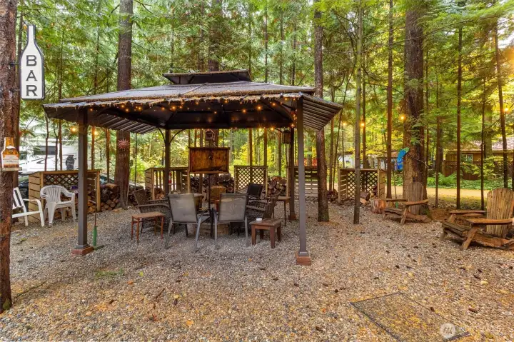 Gazebo with firepit area.