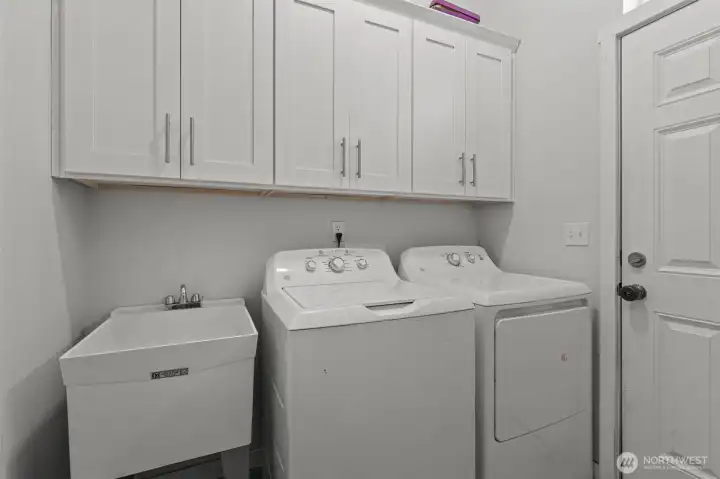 Main level Laundry room, w/ access to back patio